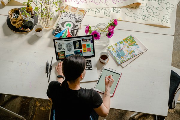 woman writing at desk