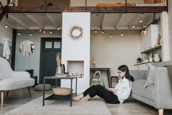 woman sitting on floor with laptop