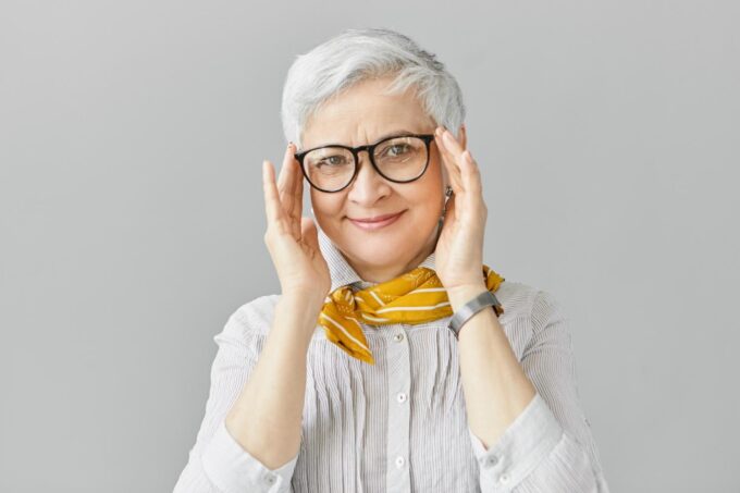 older woman glasses smiling